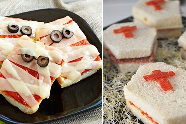 Comidas para servir na festa de halloween em casa. Finger foods no formato de mini pizza com queijo derretido por cima imitando uma múmia